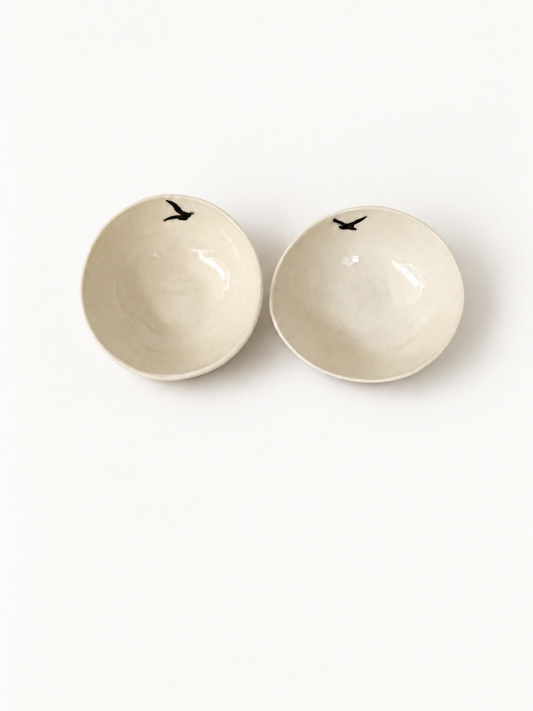 Top view of two handmade Birds Mezze Bowls