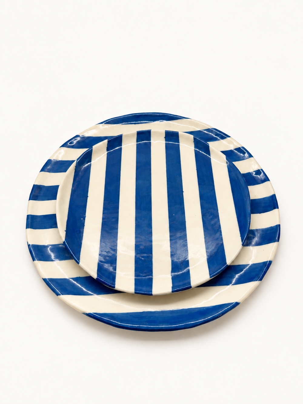 Handmade cobalt stripe dinner and side plate set, stacked