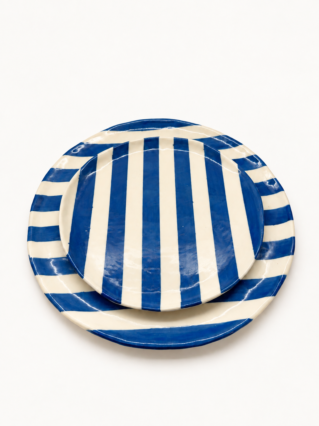 Handmade cobalt stripe dinner and side plate set, stacked