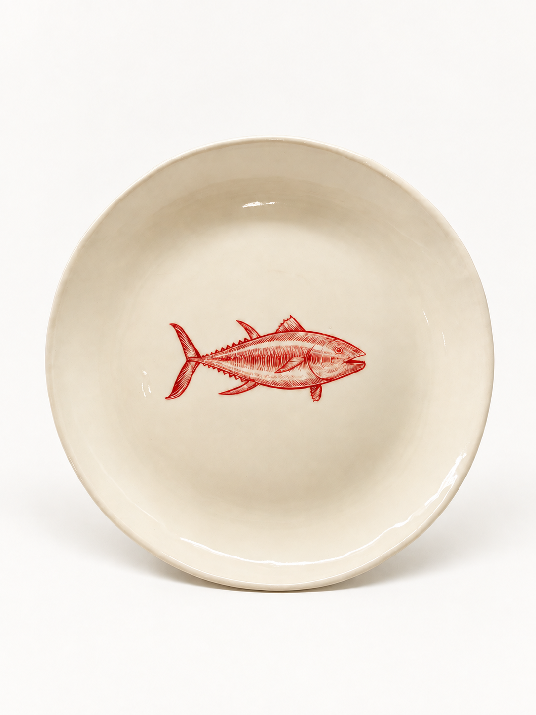 Handmade ivory fish plate with red motif, approximately 27 cm