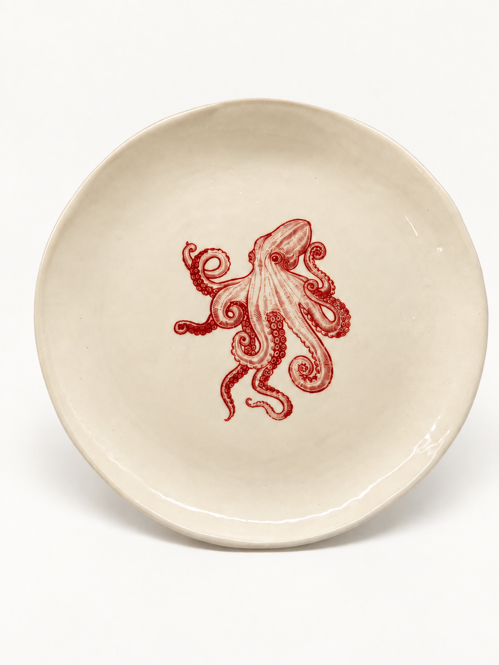 Handmade ivory octopus plate with red motif, approximately 26 cm