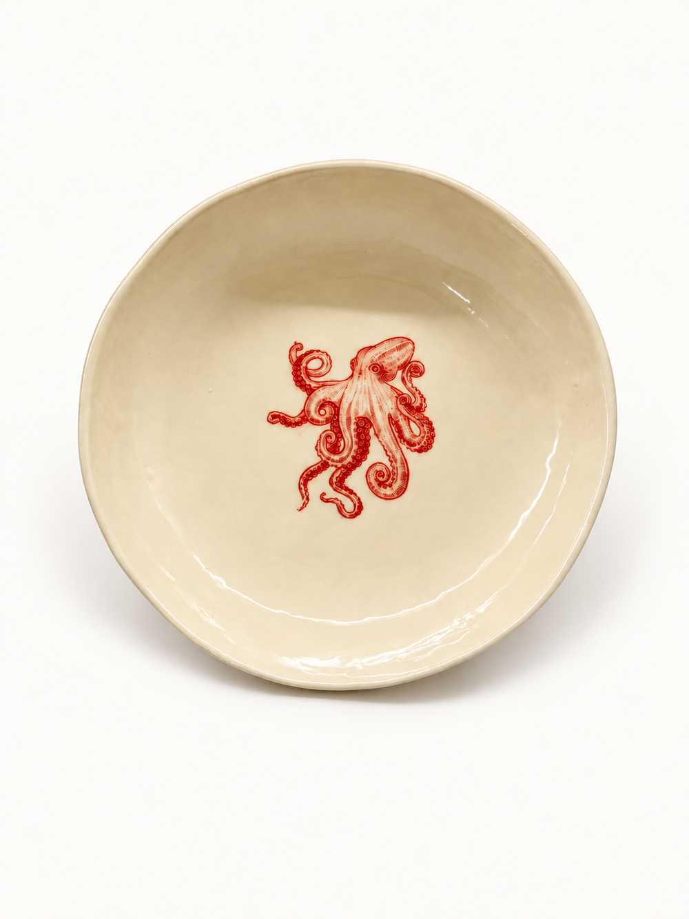 Handmade ivory octopus pasta bowl with red motif, approximately 20 cm
